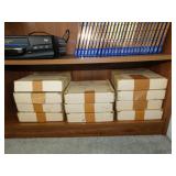 Several Garden Sanctuary bird plates in boxes