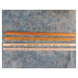 4 vintage wooden advertising yardsticks: