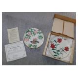 Several Garden Sanctuary bird plates in boxes