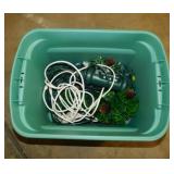 Storage tote of drop cords, Christmas lights &