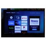 Philips 32" smart Roku TV television on stand,