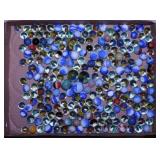 Flat of vintage swirl glass marbles