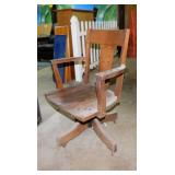 Antique oak swivel office chair on casters