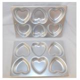 6 heart shaped cake pans, 3 are Wilton