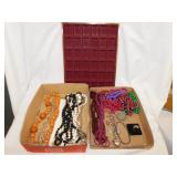 Flat of costume jewelry including necklaces,