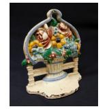 Vintage cast iron flower basket door stop