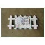 9 panels of plastic picket fence border, 18' x 9'
