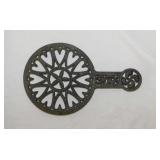 Unmarked Hearts & Thistle cast iron trivet,