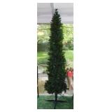Slender lighted Christmas tree in stand, 7