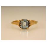 10K yellow gold ring w/ emerald cut aquamarine &