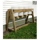 Wooden stand w/ four 5 gal. buckets, 58' x 34'