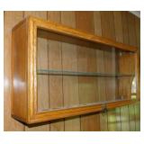 Oak & glass showcase display w/ brass lion head