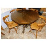 Oak pedestal dining table w/ paw feet on casters