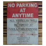 Retired masonite No Parking street sign