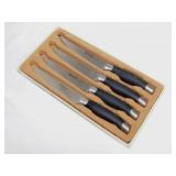 Set of 4 Anolon German steel steak knives in box,