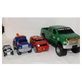 4 plastic toy trucks