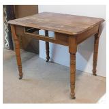 Antique primitive oak kitchen table on casters,