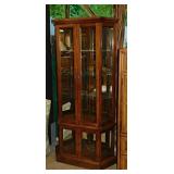 Lighted curio cabinet w/ mirrored back, 35" x 11"