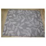 Indoor / outdoor flat weave area rug w/ botanical