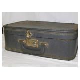 Vintage suitcase full of crafting beads