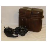 Vintage Nikon EM 35mm camera w/ lenses in leather