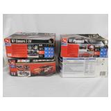 3 AMT & 1 Revell automobile model kits in box: