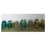 7 aqua & clear glass insulators