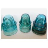 6 aqua glass insulators