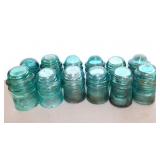 12 aqua glass insulators
