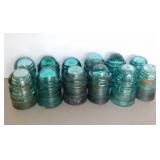 12 small aqua glass insulators