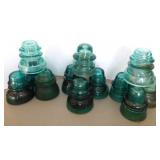 12 aqua glass insulators