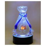 Whimsical blown glass goldfish in a bag