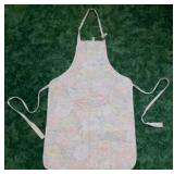 Designs quilted apron with floral accents