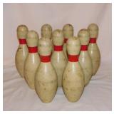9 small wooden bowling pins, 7.5' tall