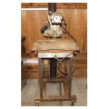 Vintage Craftsman radial arm saw on metal rolling