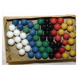 Box of vintage solid color glass game marbles