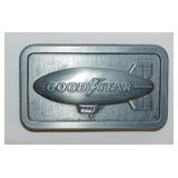 2 pewter belt buckles: Goodyear - International