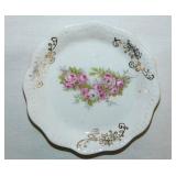 Gilded floral porcelain butter pat, unmarked