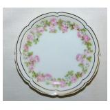 Gilded floral porcelain butter pat, unmarked
