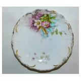 Gilded floral porcelain butter pat, unmarked