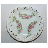 Gilded floral porcelain butter pat, unmarked