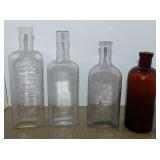 4 antique glass medicine bottles