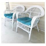 2 white wicker patio chairs w/ cushions