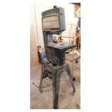 Craftsman 12" band saw on metal rolling stand