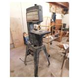 Craftsman 12" band saw on metal rolling stand