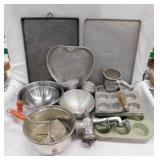 Various vintage muffin tins, cookie sheets,