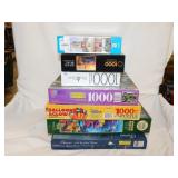 Seven 1000 piece jigsaw puzzles