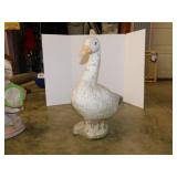 Heavy concrete goose statue, has some chips off