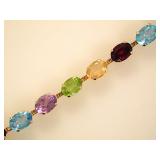 10K yellow gold 7' multi gemstone tennis bracelet,