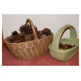 2 wicker baskets of pinecones